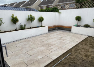 Back garden being renovated with new tile patio design